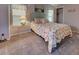 Comfortable bedroom with coastal decor, carpet, and bright window at 6562 Hikina Dr, North Port, FL 34287