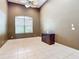 Cozy room with neutral tones, bright natural light, and tile flooring at 6594 Buckboard St, North Port, FL 34291