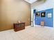 Cozy den featuring neutral tones, decorative paintings, and tile floors at 6594 Buckboard St, North Port, FL 34291