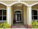 Inviting front entrance with double doors and stone pathway at 6594 Buckboard St, North Port, FL 34291