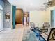 Spacious living area with ample seating and convenient access to the outdoor living space at 6594 Buckboard St, North Port, FL 34291
