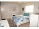 Bedroom with a ceiling fan, beachy decor, and comfortable furnishings bathed in natural light at 724 Hartford Nw Dr, Port Charlotte, FL 33952