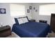 Comfortable bedroom with coastal decor, plush bedding, and plenty of natural light from two windows at 724 Hartford Nw Dr, Port Charlotte, FL 33952