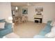 Spacious living area with comfortable sofas, piano and adjacent dining space perfect for gatherings at 724 Hartford Nw Dr, Port Charlotte, FL 33952