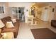 Open concept living room and kitchen include sofa, dining table, and appliances; access to the lanai at 724 Hartford Nw Dr, Port Charlotte, FL 33952