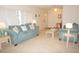 Bright and airy living room with plush sofas, side tables and serene decor at 724 Hartford Nw Dr, Port Charlotte, FL 33952