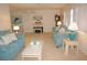Cozy living room featuring comfortable sofas, a piano, and serene artwork at 724 Hartford Nw Dr, Port Charlotte, FL 33952