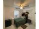Cozy bedroom with neutral colors, ceiling fan, and windows providing natural light at 2336 Picnic St, Port Charlotte, FL 33952