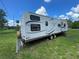 Flagstaff Classic camper featuring dark tinted windows and a decorative stripe at 2336 Picnic St, Port Charlotte, FL 33952