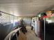 A garage with a lawn mower and a work area at 2336 Picnic St, Port Charlotte, FL 33952