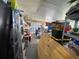 View of the cluttered garage space, providing ample storage and utility at 2336 Picnic St, Port Charlotte, FL 33952
