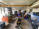 Wide angle of a cluttered, spacious garage with natural light and ample storage at 2336 Picnic St, Port Charlotte, FL 33952
