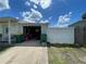 Exterior shot of the property showcasing the garage and driveway at 2336 Picnic St, Port Charlotte, FL 33952