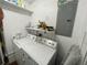 Functional laundry area features a washing machine, dryer, and upper shelves at 2336 Picnic St, Port Charlotte, FL 33952