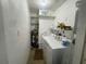 Functional laundry area features a washing machine, dryer, and water heater at 2336 Picnic St, Port Charlotte, FL 33952
