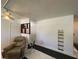 Bright living room featuring tile floors, ceiling fan and a large built in wall unit at 2336 Picnic St, Port Charlotte, FL 33952