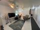 Bright living room featuring tile floors and ceiling fan at 2336 Picnic St, Port Charlotte, FL 33952