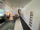 Bright living room featuring tile floors, ceiling fan and a large built in wall unit at 2336 Picnic St, Port Charlotte, FL 33952
