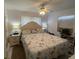 Bedroom featuring a comfortable bed, side tables, and natural light at 2336 Picnic St, Port Charlotte, FL 33952