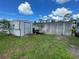 Exterior view of the shed and trailer in the backyard at 2336 Picnic St, Port Charlotte, FL 33952