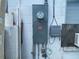 Electric meter, shut off, and assorted junction boxes mounted on a wall at 2336 Picnic St, Port Charlotte, FL 33952