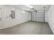 Spacious garage with a window and an automatic door for convenient vehicle parking at 1107 Seneca Rd, Venice, FL 34293