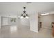 Bright living room offering tile floors, a modern ceiling fan, and access to the kitchen, enhancing daily living at 1107 Seneca Rd, Venice, FL 34293