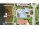 Overhead view shows pool, private boat lift, landscaping, and home's layout at 119 Creek Se Dr, Port Charlotte, FL 33952