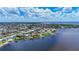 Community aerial showcases the waterfront homes with private docks along canals at 119 Creek Se Dr, Port Charlotte, FL 33952