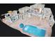 Aerial rendering featuring the pool and backyard with paver patio and water views at 119 Creek Se Dr, Port Charlotte, FL 33952