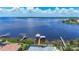 Waterfront view showcases a private boat lift and picturesque water access at 119 Creek Se Dr, Port Charlotte, FL 33952