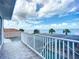 Spacious balcony boasts tranquil water views with beautiful blue skies and updated railings at 119 Creek Se Dr, Port Charlotte, FL 33952