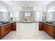 Huge bathroom with double sink vanities and walk-in shower with glass surround at 119 Creek Se Dr, Port Charlotte, FL 33952