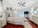 Large bedroom suite with ceiling fan, TV, dresser, and access to a patio at 119 Creek Se Dr, Port Charlotte, FL 33952