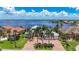 Stunning waterfront home with lush landscaping, brick driveway, and picturesque water views at 119 Creek Se Dr, Port Charlotte, FL 33952