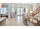Open Foyer featuring high ceilings, tile floors, glass paneled doors, and modern decor at 119 Creek Se Dr, Port Charlotte, FL 33952
