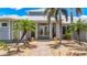 Charming home entrance with beautiful landscaping, stone pathway, and decorative accents at 119 Creek Se Dr, Port Charlotte, FL 33952