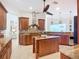 Spacious gourmet kitchen features a large center island, stainless appliances, and custom cabinetry at 119 Creek Se Dr, Port Charlotte, FL 33952