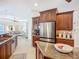 Beautiful kitchen features stainless steel appliances, breakfast bar, and custom cabinets at 119 Creek Se Dr, Port Charlotte, FL 33952