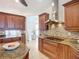 Bright kitchen features stainless steel range hood, tile backsplash, and custom cabinetry at 119 Creek Se Dr, Port Charlotte, FL 33952