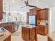 Open concept kitchen with custom cabinets, stainless steel appliances, and large center island at 119 Creek Se Dr, Port Charlotte, FL 33952