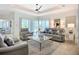 Elegant living room with sliding glass doors to the pool and waterfront view at 119 Creek Se Dr, Port Charlotte, FL 33952