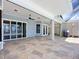 Covered patio features recessed lighting, a ceiling fan, and lots of outdoor seating space at 119 Creek Se Dr, Port Charlotte, FL 33952