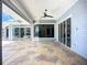 Covered patio featuring recessed lighting, a ceiling fan, water views, and lots of seating space at 119 Creek Se Dr, Port Charlotte, FL 33952