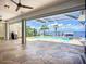Outdoor pool and spa area with large patio, grill, beautiful water views, and lots of space at 119 Creek Se Dr, Port Charlotte, FL 33952