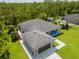 This home has a meticulously maintained lawn, a shed, and a pristine driveway and walkway at 12300 El Prado Dr, Punta Gorda, FL 33955