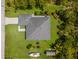 Aerial view of the home showcasing its well-maintained landscaping, spacious layout, and boat parking at 12300 El Prado Dr, Punta Gorda, FL 33955