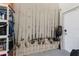 Organized garage space featuring fishing rods storage and shelving units at 12300 El Prado Dr, Punta Gorda, FL 33955