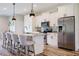Modern kitchen featuring stainless steel appliances, granite countertops, and seating at the island at 12300 El Prado Dr, Punta Gorda, FL 33955
