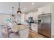 Modern kitchen featuring stainless steel appliances, granite countertops, and seating at the island at 12300 El Prado Dr, Punta Gorda, FL 33955